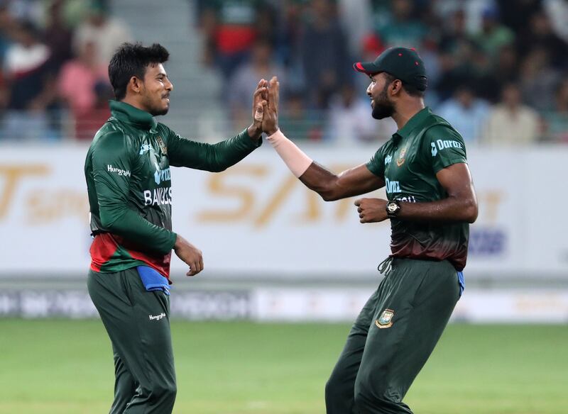 Bangladesh bowler Mosaddek Hossain celebrates after taking the wicket of UAE's Aryan Lakra.