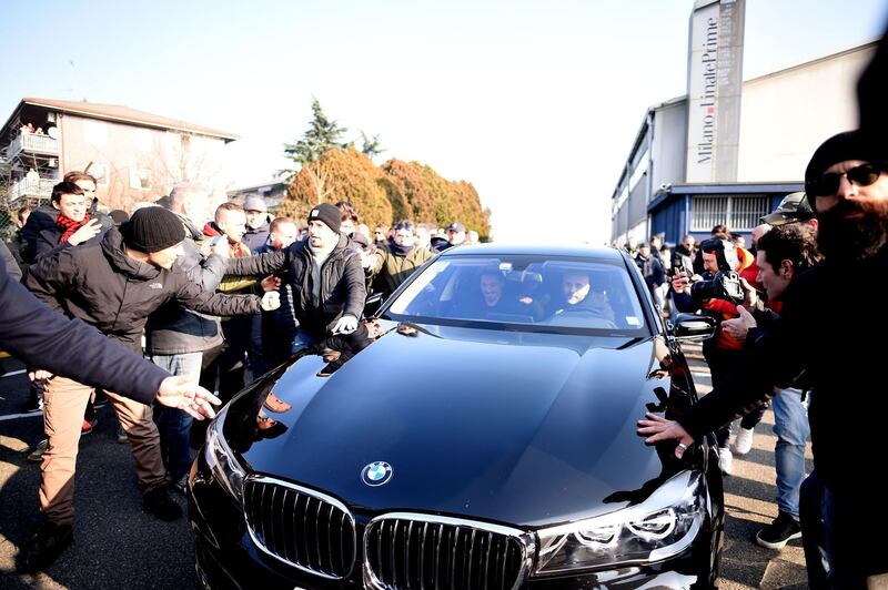 AC Milan forward Zlatan Ibrahimovic surrounded by supporters after his arrival. AFP