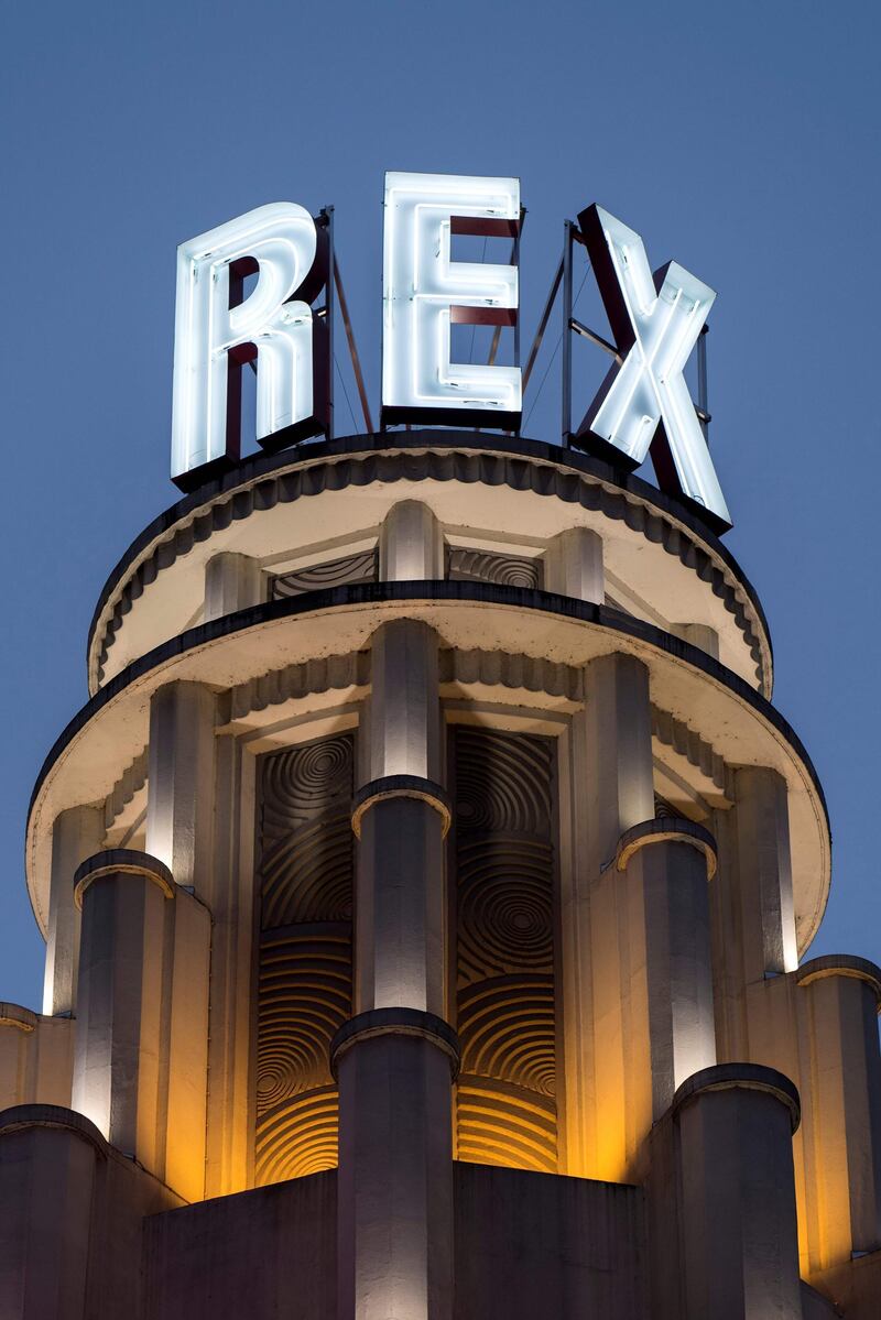 (FILES) This file photo taken on January 11, 2018 shows the exterior of the Grand Rex film theatre in Paris. One of France's most iconic cinemas it to shut its doors for the month of August because so few people want to risk seeing movies on the big screen. Managers at the enormous Grand Rex in the centre of Paris -- which remained open throughout World War II -- said on July 27, 2020, Hollywood studios were also to blame for holding back the release of so many of its summer blockbusters. / AFP / PHILIPPE LOPEZ
