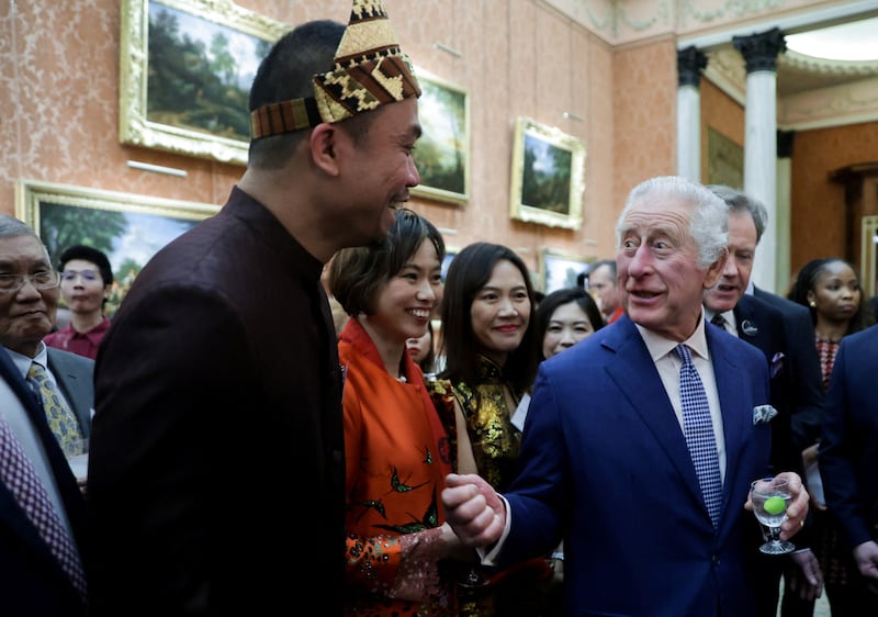 King Charles with representatives of Britain's East and South-East Asian communities at Buckingham Palace. Reuters