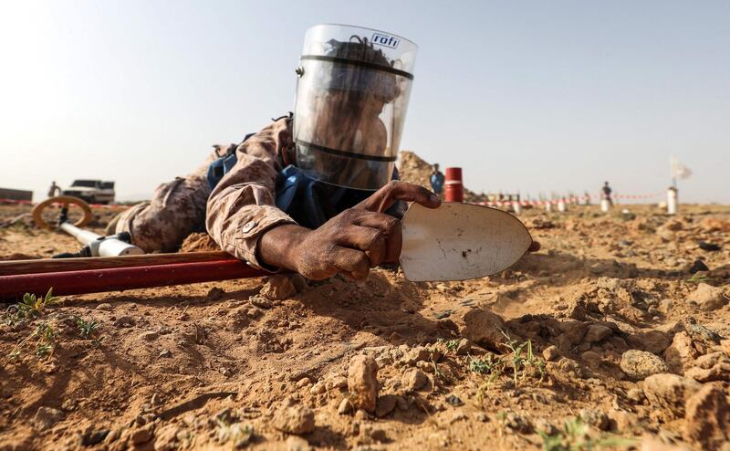 A Yemeni government soldier takes part in a UAE-run mine clearance and dismantling training at a centre north of Mukalla. AFP