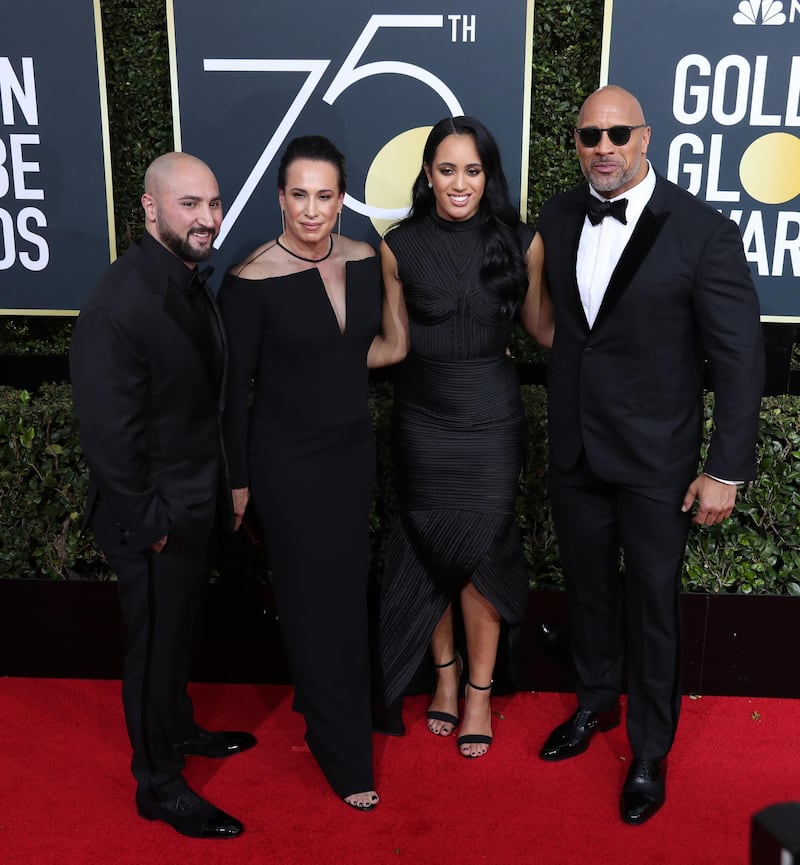 epa06424641 (L-R) Dave Rienzi, producer Dany Garcia, 2018 Golden Globe Ambassador Simone Garcia Johnson and actor Dwayne Johnson  arrive for the 75th annual Golden Globe Awards ceremony at the Beverly Hilton Hotel in Beverly Hills, California, USA, 07 January 2018.  EPA-EFE/MIKE NELSON