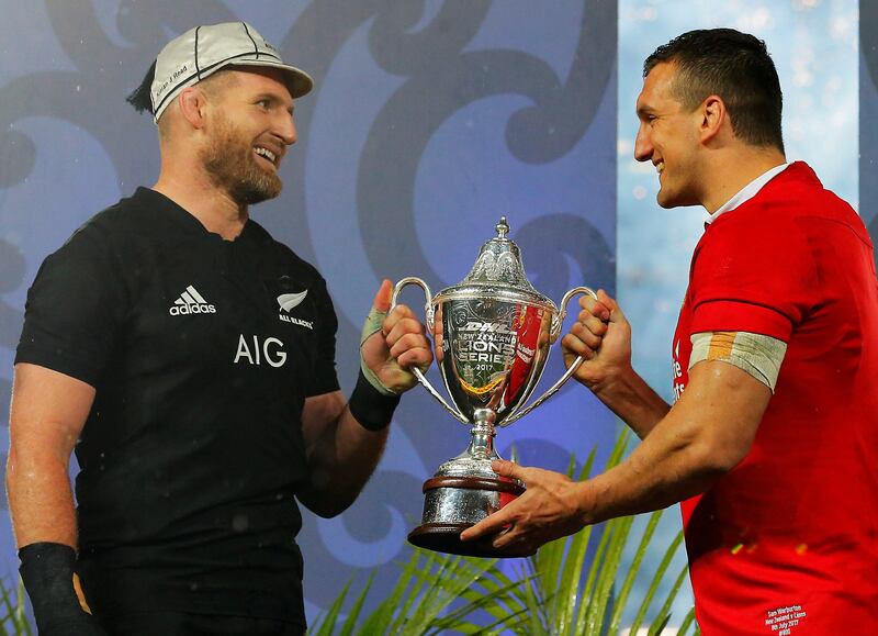 New Zealand's Kieran Read, left, and Lions' Sam Warburton with the trophy after the match.