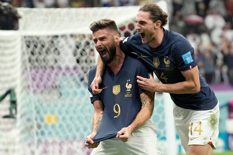 Olivier Giroud, left, celebrates with Adrien Rabiot after scoring France's winner. AP