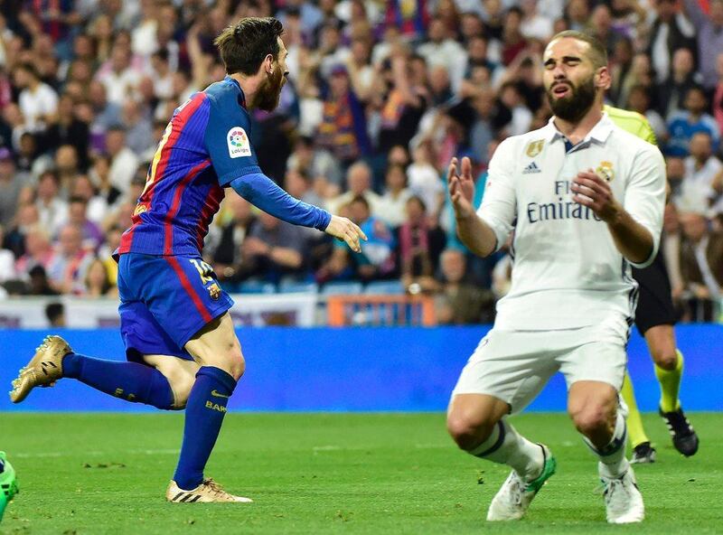 Messi, left, celebrates his 500th career Barceloan goal, having scored No 499 earlier in the match. Gerard Julien / AFP