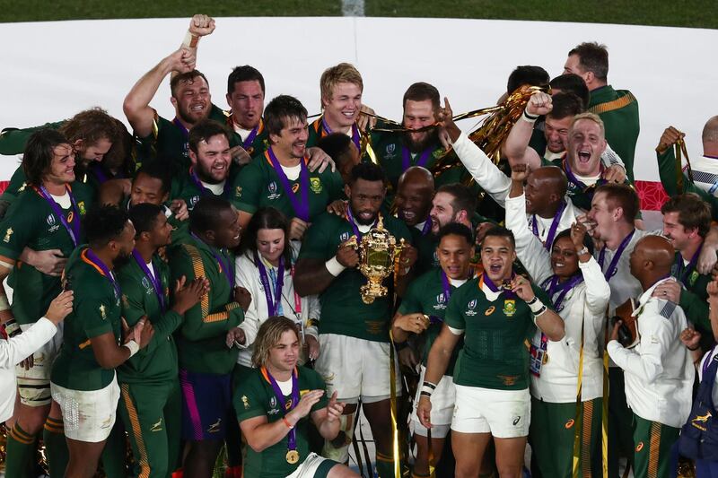 South Africa players celebrate with the trophy. AFP