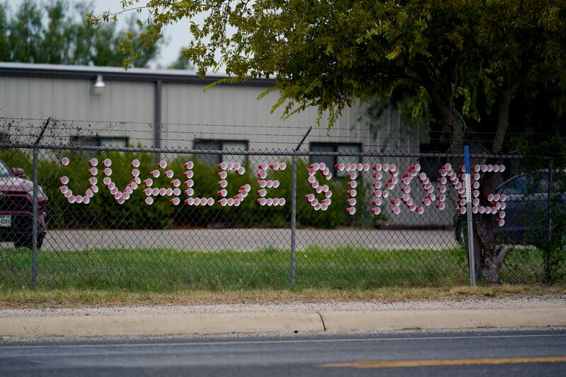 A 'Uvalde Strong' message is posted in front of the Uvalde County Mental Health building. AP