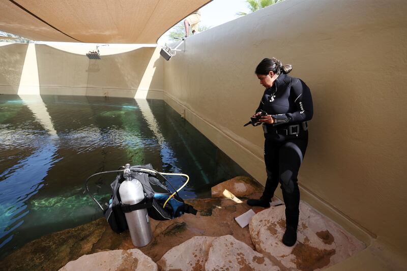 Tarryn Abrahams prepares to clean a tank 