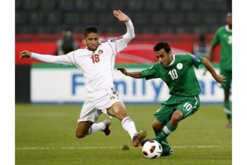 Saudi Arabia, in green, lost despite dominating the first half. Kin Cheung / AP Photo