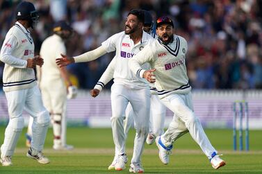 India's Virat Kohli, right, and Mohammed Siraj celebrate the wicket of England's Jos Buttler during day five of the Second Test match at Lord's, London, Monday Aug.  16, 2021.  (Zac Goodwin / PA via AP)