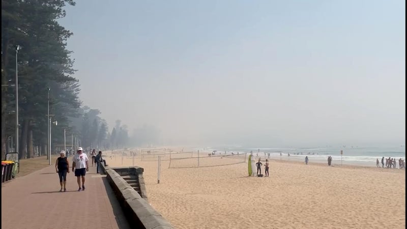 A still image taken from a social media video shows haze blanketing Manly Beach in Sydney, Australia November 19, 2019. Reuters