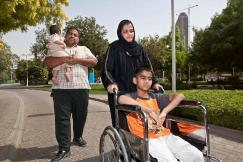 July 13. Aslam Basha, who was injured in a bus accident at school, with his mother Altaf, his farther Alam and one year old Brother Sudais. July 13, Dubai, United Arab Emirates (Photo: Antonie Robertson/The National)