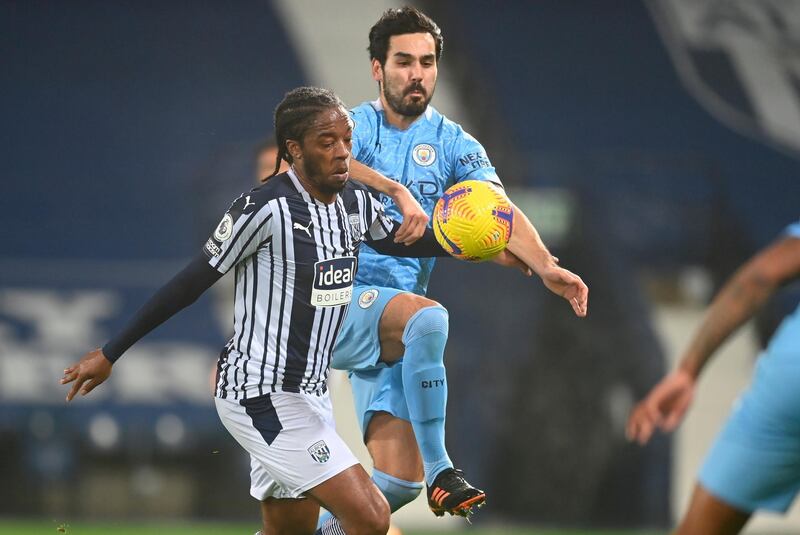Manchester City's Ilkay Gundogan in action with West Bromwich Albion's Romaine Sawyers. EPA
