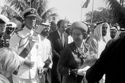 Queen Elizabeth II and the Duke of Edinburgh on a tour of Abu Dhabi. PA Images via Getty
