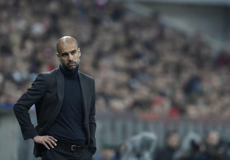 Bayern Munich coach Pep Guardiola reacts during the Uefa Champions League second-leg semi-final loss to Real Madrid CF in Munich, southern Germany, on April 29, 2014. AFP PHOTO / ODD ANDERSEN