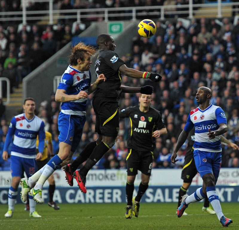 Norwich City's French-born Cameroonian defender Sebastien Bassong (3rd L) vies with Reading's Latvian defender Kaspars Gorkss (2nd L) during the English Premier League football match between Reading and Norwich City at The Madejski Stadium, in Reading, England on November 10, 2012. The game finished 0-0. AFP PHOTO/CARL COURT

RESTRICTED TO EDITORIAL USE. No use with unauthorized audio, video, data, fixture lists, club/league logos or “live” services. Online in-match use limited to 45 images, no video emulation. No use in betting, games or single club/league/player publications
 *** Local Caption ***  864736-01-08.jpg