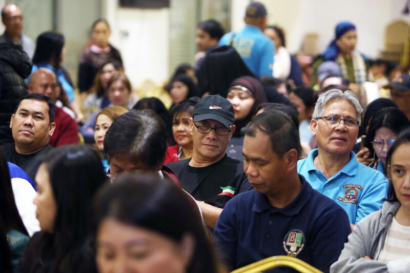 Members of the Filipino community working and residing in Kuwait attend a meeting with their country's Labour Department Undersecretary for Workers Protection, Human Resource, and Internal Auditing Services Cluster, at the Philippines' Embassy in Kuwait City, on February 24, 2018.
The employers of the murdered 29-year-old Filipina maid Joanna Demafelis, whose body was found dead in a freezer in Kuwait, were both arrested in the Syrian capital Damascus, a Lebanese judicial official said on February 24.
The murder had sparked outrage in the Philippines and prompted President Rodrigo Duterte to impose a departure ban for Filipinos planning to work in Kuwait. / AFP PHOTO / YASSER AL-ZAYYAT