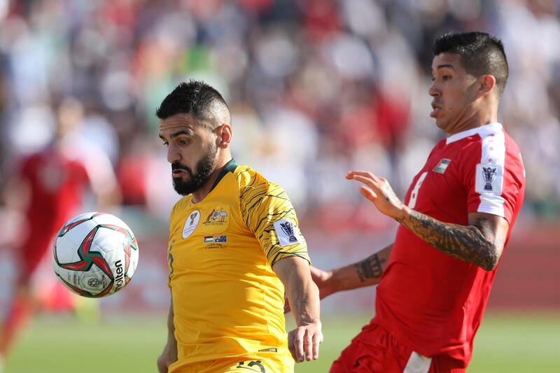 Aziz Behich of Australia battles for possession with Jonathan Zorrilla of Palestine. Getty Images