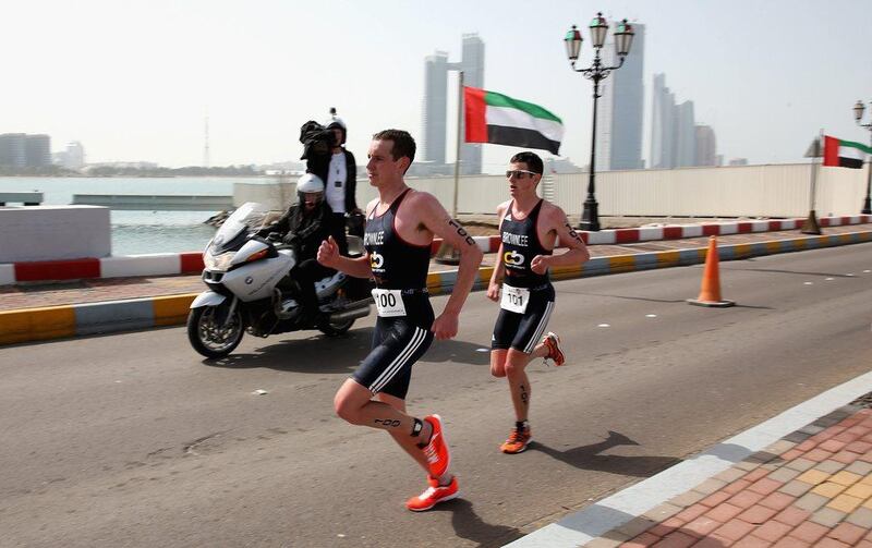 Alistair Brownlee, left, and Jonny Brownlee, right, finished joint first in the short course race at the Abu Dhabi International Triathlon on Saturday. Warren Little / Getty Images/ IMG / March 15, 2014