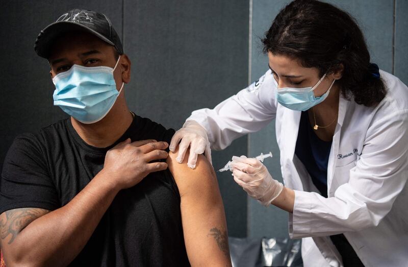 Javier Morena receives his first dose of the Moderna Covid-19 vaccine at the Jewish Community Center, a pop up vaccine clinic on April 16, 2021 in the Staten Island borough of New York City.  / AFP / Angela Weiss
