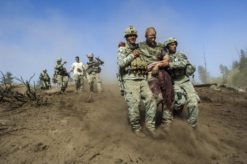 American soldiers, some wounded, on a mission in the Korengal Valley in Afghanistan, 2007. Courtesy Lynsey Addario