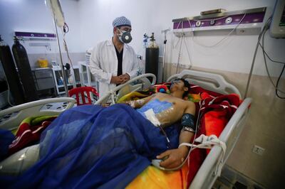 A man is treated at a hospital after he was injured during last night's rocket attack on U.S.-led forces in and near Erbil International Airport, in Erbil, Iraq February 16, 2021. REUTERS/Azad Lashkari