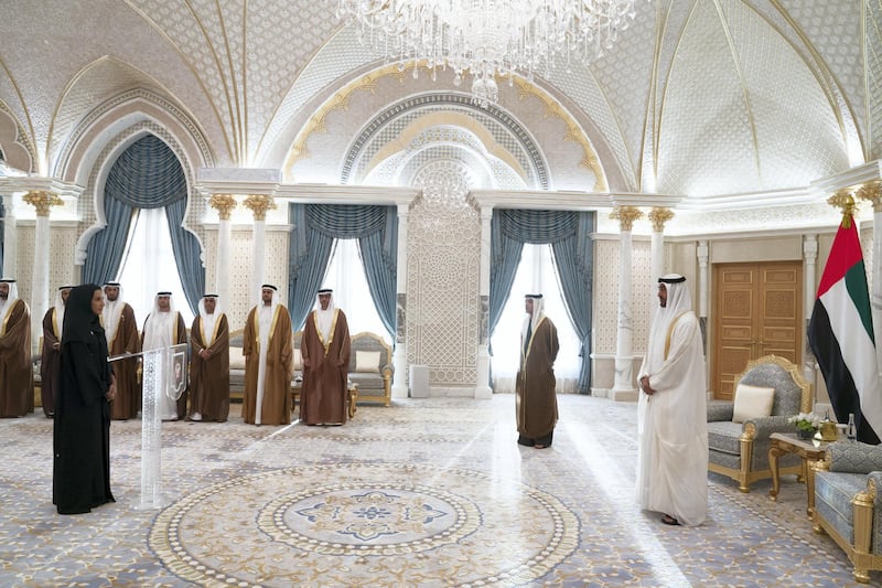 ABU DHABI, UNITED ARAB EMIRATES - March 10, 2019: HE Sara Awad Issa Musallam, Chairperson of the Department of Education and Knowledge and Abu Dhabi Executive Council Member (L),  gives his oath during a swearing-in ceremony for new members of the Abu Dhabi Executive Council, at the Presidential Palace. Witnessed by HH Sheikh Mohamed bin Zayed Al Nahyan, Crown Prince of Abu Dhabi and Deputy Supreme Commander of the UAE Armed Forces (R), HH Sheikh Hazza bin Zayed Al Nahyan, Vice Chairman of the Abu Dhabi Executive Council (back 2nd R), HH Sheikh Hamed bin Zayed Al Nahyan, Chairman of the Crown Prince Court of Abu Dhabi and Abu Dhabi Executive Council Member (3rd R), HH Sheikh Diab bin Zayed Al Nahyan (4th R), HE Jassem Mohamed Bu Ataba Al Zaabi, Chairman of Abu Dhabi Executive Office and Abu Dhabi Executive Council Member (4th R), HE Dr Ahmed Mubarak Al Mazrouei, Secretary General of the Abu Dhabi Executive Council (5th R), HE Sheikh Abdulla bin Mohamed Al Hamed, Chairman of the Health Department and Abu Dhabi Executive Council Member (6th R),HE Saif Mohamed Al Hajeri, Chairman of Department of Economic Development, and Abu Dhabi Executive Council Member (7th R) and HE Mohamed Khalifa Al Mubarak, Chairman of the Department of Culture and Tourism and Abu Dhabi Executive Council Member (back L). 

( Mohamed Al Hammadi / Ministry of Presidential Affairs )
---