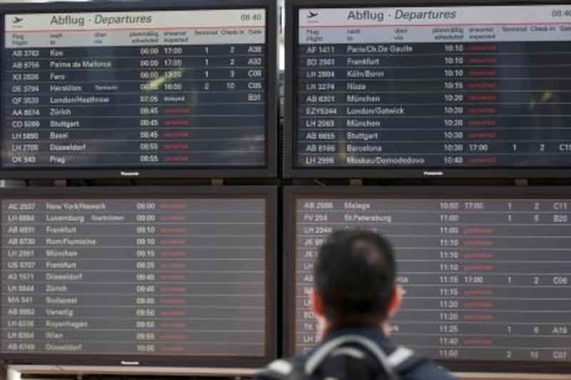 A passengers looks at the information board that shows most of the flights canceled due to elevated levels of ash in the atmosphere stemming from Iceland's Grimsvotn volcano, at the airport in Hamburg, northern Germany, Wednesday, May 25, 2011. German weather authorities say that starting at 11:00 a.m. (0900GMT) all air traffic from Berlin's airports will be stopped as a security precaution due to elevated levels of ash from an Icelandic volcano. (AP Photo/dapd, Philipp Guelland) *** Local Caption ***  LGL107_Germany_Iceland_Volcano.jpg