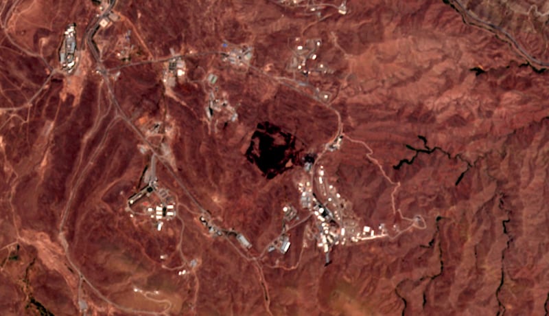 This Friday, June 26, 2020, photo from the European Commission's Sentinel-2 satellite shows the site of an explosion that rattled Iranâ€™s capital. Analysts say the blast came from an area in Tehranâ€™s eastern mountains they hides a underground tunnel system and missile production sites. The explosion appears to have charred hundreds of meters of scrubland. (European Commission via AP)