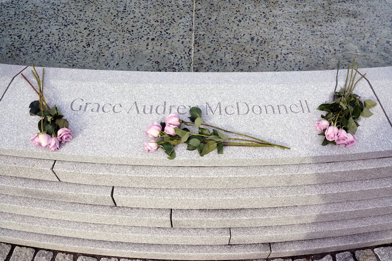 Flowers are placed around the name of Grace McDonnell, one of the victims of the shooting. Reuters