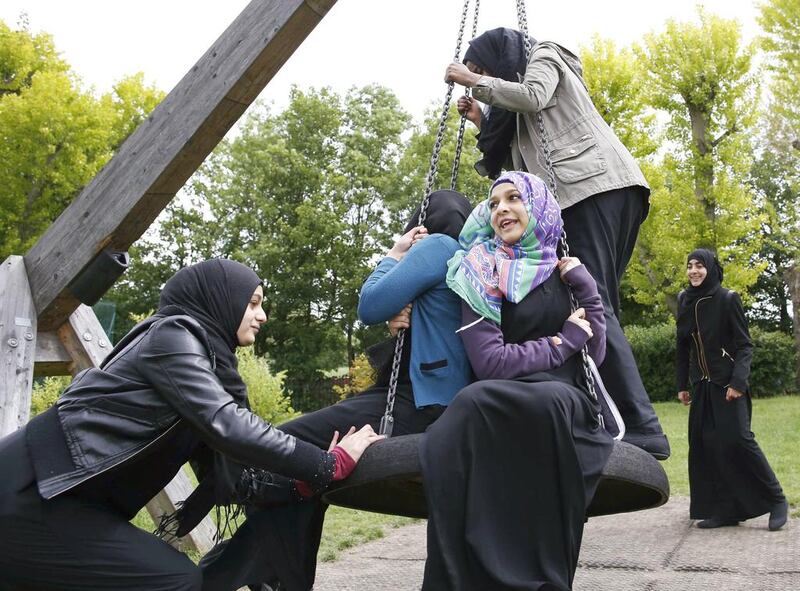 Yasmin Navsa, 17, left, says wearing a hijab makes her stand out. Olivia Harris / Reuters