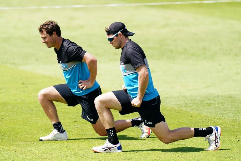 New Zealand's Tom Latham, right, stretches during training. PA