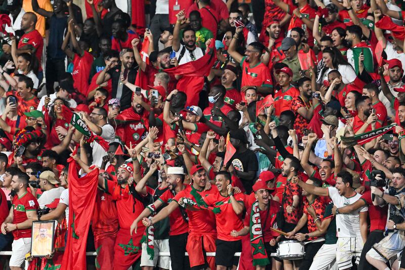 Morocco fans celebrate during the match against Tanzania at Stade Laurent Pokou. AFP