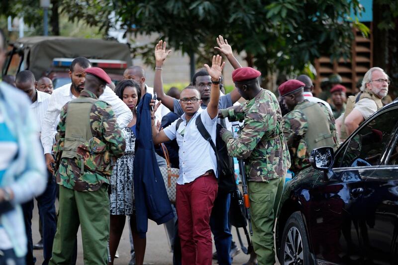 Kenyan armed forces rescue people after an attack on a hotel, in Nairobi, Kenya. Extremists launched a deadly attack on a luxury hotel in Kenya's capital Tuesday, sending people fleeing in panic as explosions and heavy gunfire reverberated through the complex. A police officer said he saw bodies, "but there was no time to count the dead." AP Photo