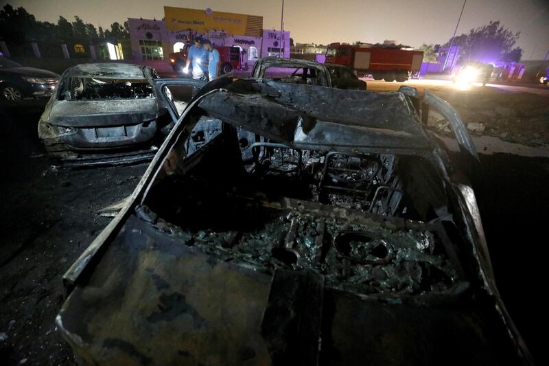 Burned vehicles are seen following a fire that broke out in Egypt's Shuqair-Mostorod crude oil pipeline, at the beginning of Cairo-Ismailia road, Egypt. REUTERS