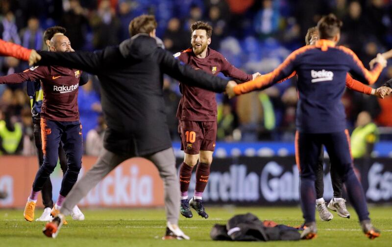 Vice-captain Lionel Messi, centre, celebrates winning his ninth La Liga crown with Barcelona. REUTERS/Miguel Vidal