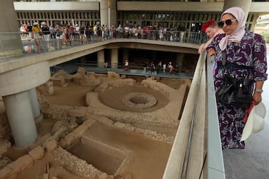 Visitors view the excavation site beneath the Museum of Acropolis in Athens, Greece, in June 2019, during the museum's 10 years celebration. EPA