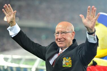 (FILES) English former football player Bobby Charlton waves to Japanese football fans prior to a friendly football  match between Manchester United and Japan's Yokohama F Marinos at Nissan Stadium in Yokohama on July 23, 2013.  England World Cup winner and Manchester United great Bobby Charlton has died at the age of 86, it was announced on October 21, 2023.  "Manchester United are in mourning following the passing of Sir Bobby Charlton, one of the greatest and most beloved players in the history of our club," the club said in a statement.  (Photo by Kazuhiro NOGI  /  AFP)