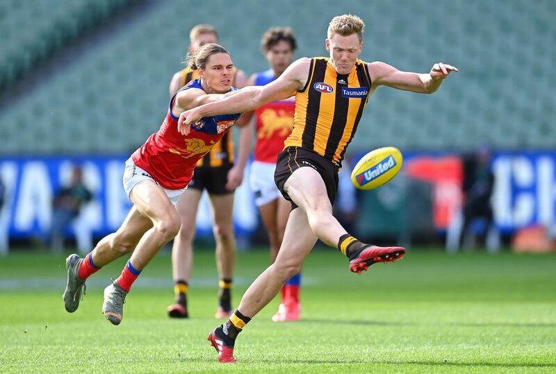 James Sicily of the Hawks is tackled by Eric Hipwood of the Lions on Sunday. Getty Images