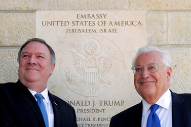 US Ambassador to Israel David Friedman, right, stands with Secretary of State Mike Pompeo next to the dedication plaque at the US embassy in Jerusalem. Reuters