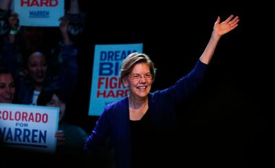 Democratic presidential candidate Sen. Elizabeth Warren, D-Mass., waves as she takes the stage to speak at a campaign rally Sunday, Feb. 23, 2020, in Denver. (AP Photo/David Zalubowski)