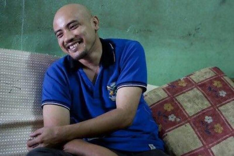 Nazarrudin Saidin, who was released after being kidnapped in the Philippines about a year ago, smiles as he details his ordeal in Sungai Buloh near Kuala Lumpur, Malaysia.