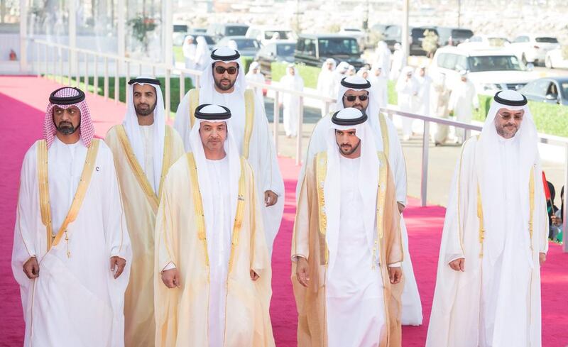 Sheikh Sultan bin Mohammed, Crown Prince of Sharjah, right, Sheikh Mohammed bin Hamad, Crown Prince of Fujairah, second right, Sheikh Hamdan bin Mohammed, Crown Prince of Dubai, third right, Sheikh Rashid bin Saud, Crown Prince of Umm Al Quwain, fourth right, Sheikh Ammar bin Humaid, Crown Prince of Ajman, left, Sheikh Mohammed bin Saud, Crown Prince and Deputy Ruler of Ras Al Khaimah, second left, and Sheikh Hazza bin Zayed, Vice Chairman of the Abu Dhabi Executive Council, third left, Crown Princes and dignitaries attend a flag raising ceremony in celebration of the UAE’s 45th National Day, at the Breakwater in Abu Dhabi. Mohamed Al Suwaidi / Crown Prince Court - Abu Dhabi