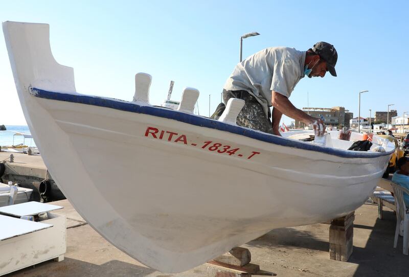 Boat maintenance in Batroun, Lebanon. Reuters