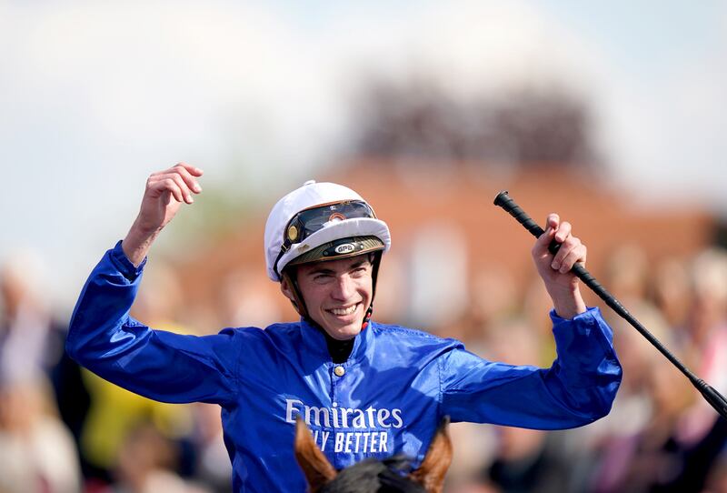 Jockey James Doyle celebrates after winning the 2000 Guineas Stakes on Coroebus at Newmarket on April 30. PA