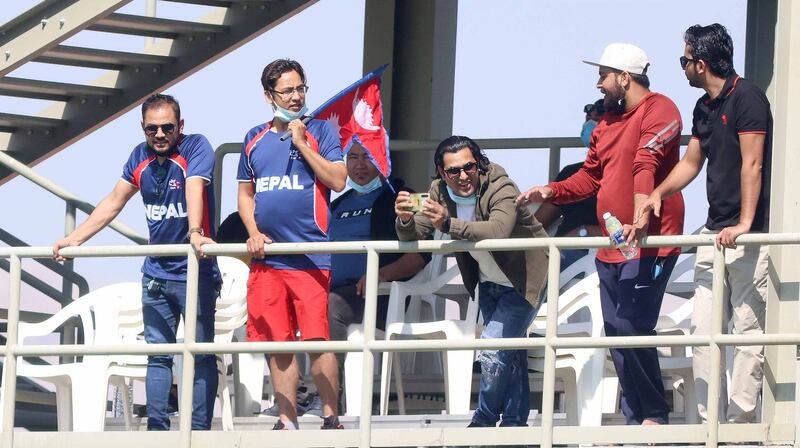 Nepalese fans cheer their side on.