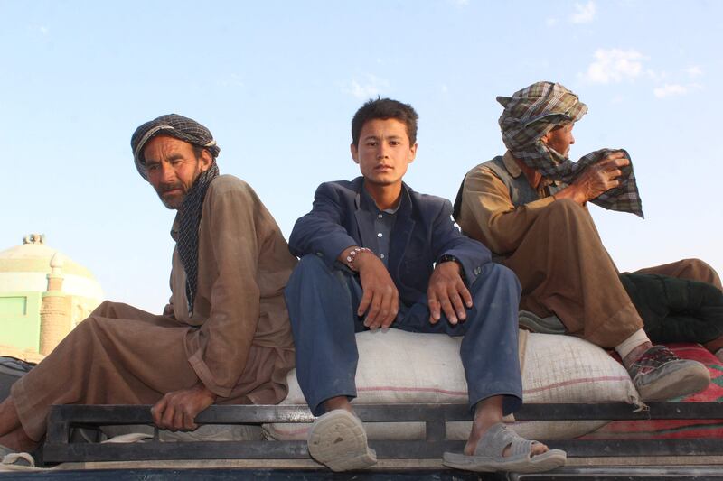 Afghan Shiite villagers sit on the top of a vehicle as they leave after being released by insurgents in the northern province of Sar-e Pul on August 9, 2017.
Taliban and Islamic State fighters unleashed a killing spree targeting civilians after capturing a remote village in northern Afghanistan, traumatised families said August 9, after being released by the insurgents. The militants killed about 50 villagers, including women and children in Mirzawalang -- a mainly Shiite village in Sayad district of northern Sar-e Pul province -- on August 5 after overrunning a government-backed militia, said officials. / AFP PHOTO / STR