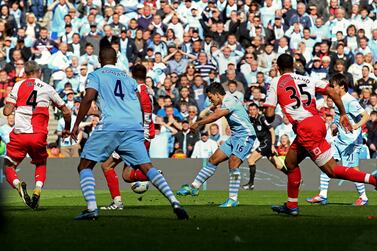 MANCHESTER, ENGLAND - MAY 13:  Sergio Aguero of Manchester City scores his team's third and matchwinning goal during the Barclays Premier League match between Manchester City and Queens Park Rangers at the Etihad Stadium on May 13, 2012 in Manchester, England.  (Photo by Alex Livesey/Getty Images)