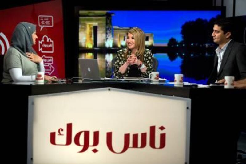 Hala Sarhan hosts political activists, from left, Asmaa Mahfouz and Abdelaziz Abdallah on her show "Nassbook" ("The People's Book") in Cairo, Egypt, July 6, 2011. The show is centered around politics, social media and Egypt's recent uprising, which led to the resignation of President Hosni Mubarak and a host of other changes. Sarhan confronted corruption, sectarian issues, poverty and prostitution as a television presenter and host in 2006. She left Egypt for Dubai under a cloud, and a warrant for her arrest was issued shortly thereafter for, in her words, "slandering the reputation of Egypt." She spent the next years in exile and finally returned to the new Egypt, and Egyptian television, in May.