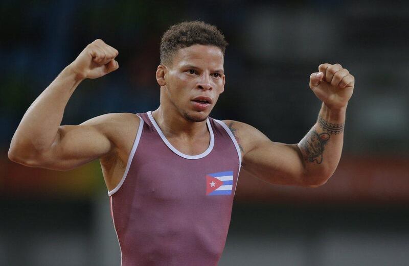 Ismael Borrero Molina of Cuba reacts after defeating Elmurat Tasmuradov of Uzbekiston during the men’s Greco-Roman 59kg semi-final match of the Rio 2016 Olympic Games Wrestling events at the Carioca Arena 2 in the Olympic Park in Rio de Janeiro, Brazil, 14 August 2016. Sergei Ilnitsky / EPA